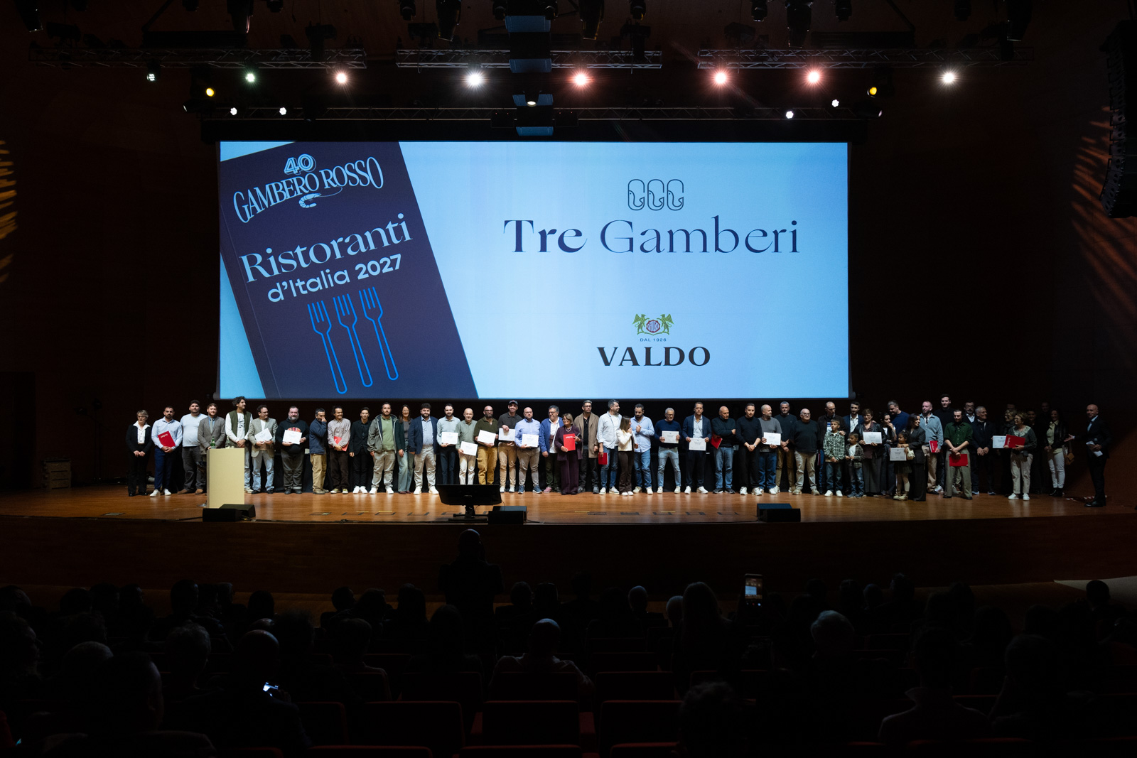 The Ristoranti d’Italia 2027 ceremony: the Tre Gamberi awards on stage.