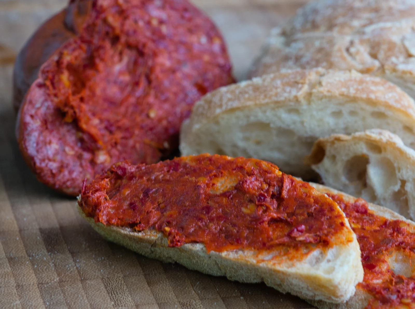 'Nduja sliced and spread on bread, illustrative photograph