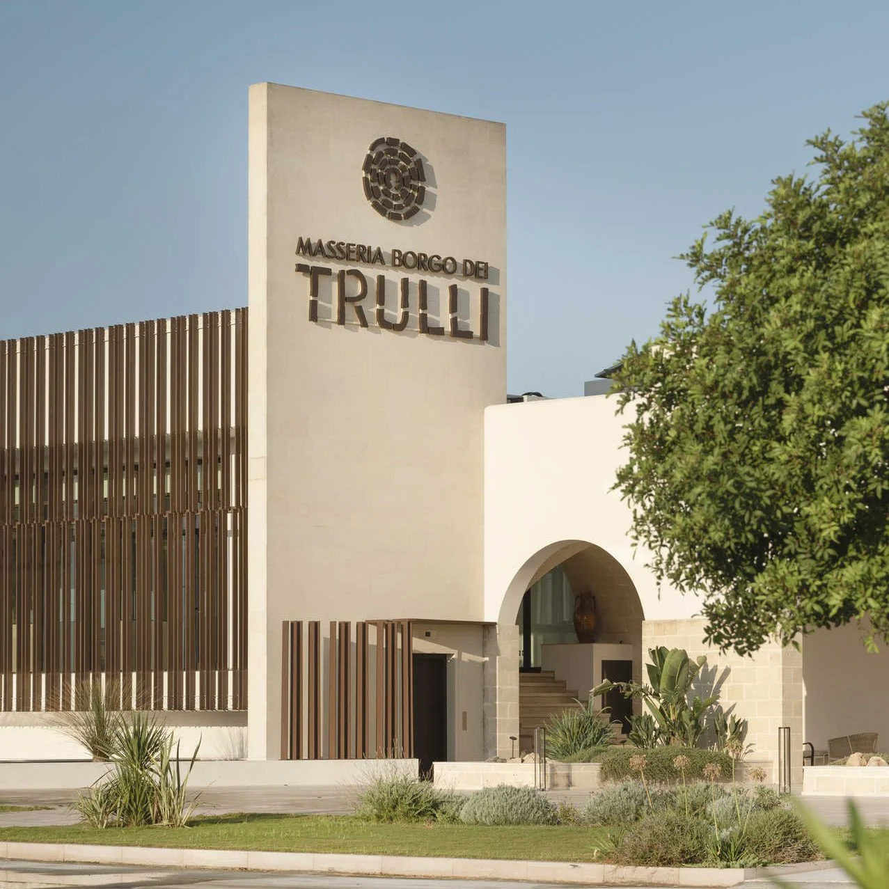The entrance to Masseria Borgo dei Trulli with the winery sign